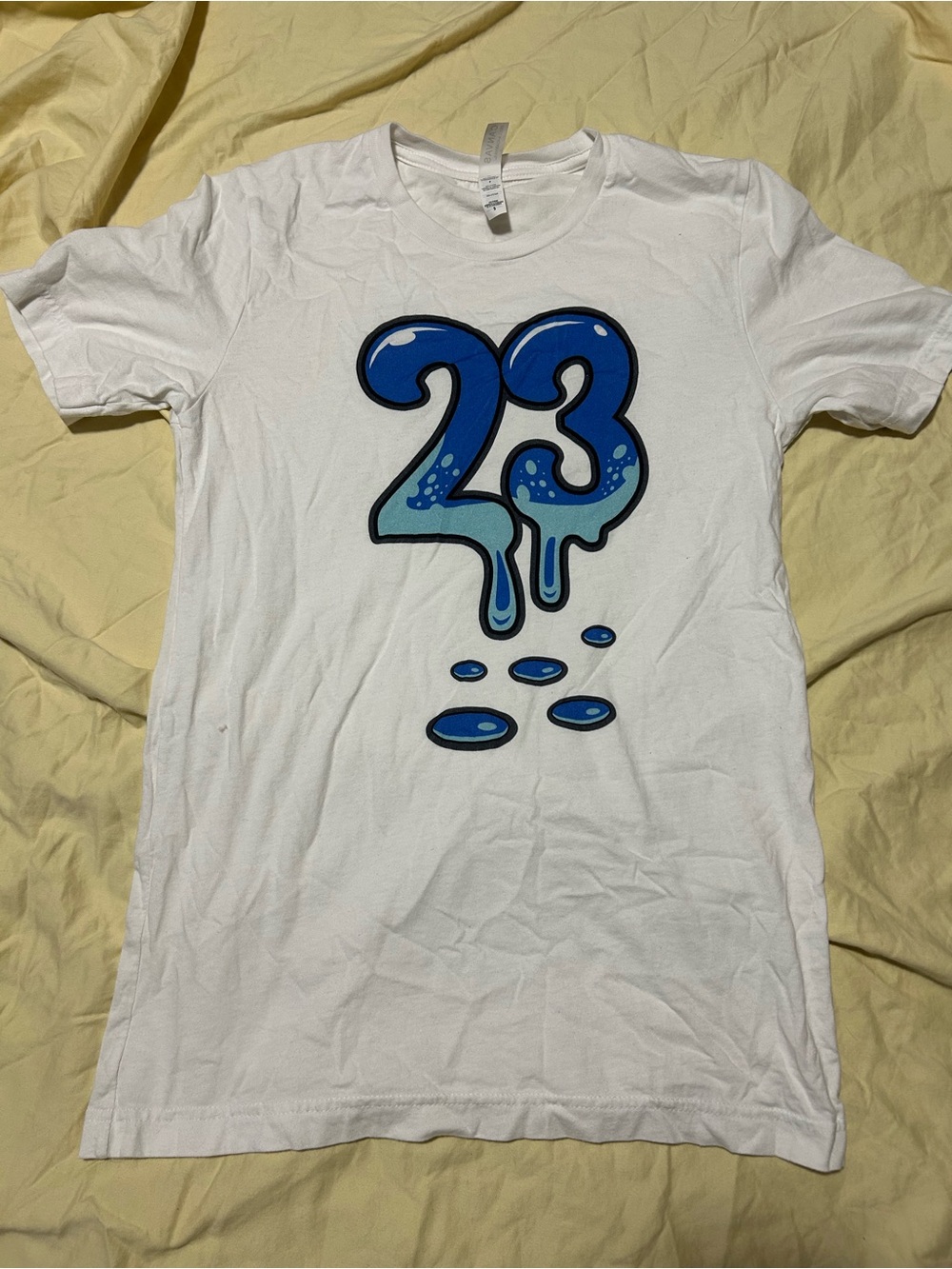 White Graphic Tee with Blue '23' Drip Design